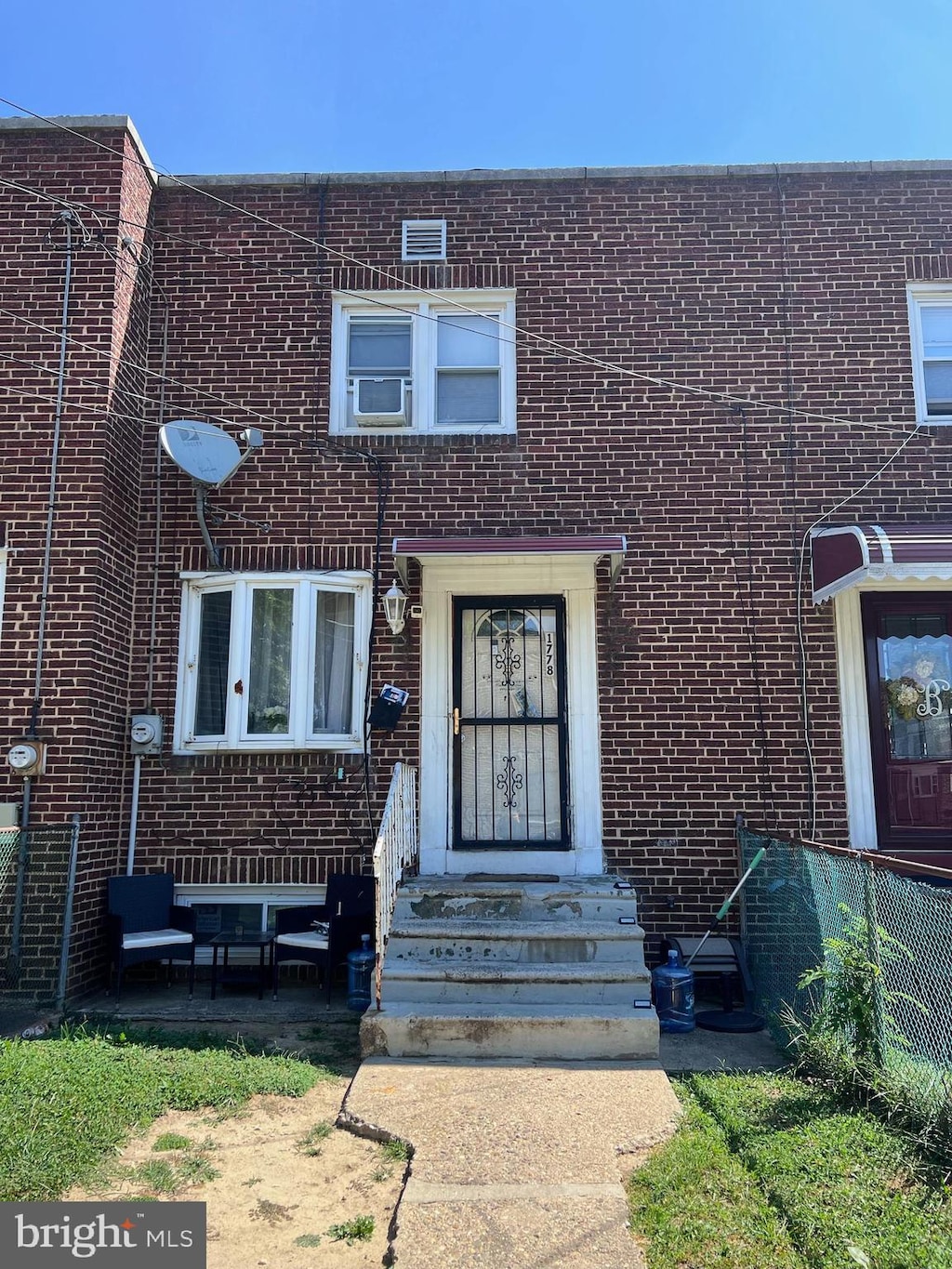 view of property featuring brick siding