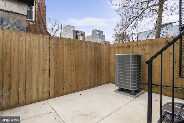 view of patio with central AC