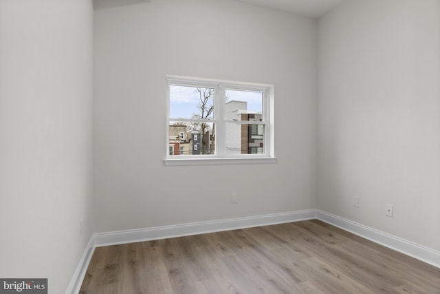 empty room with light hardwood / wood-style flooring