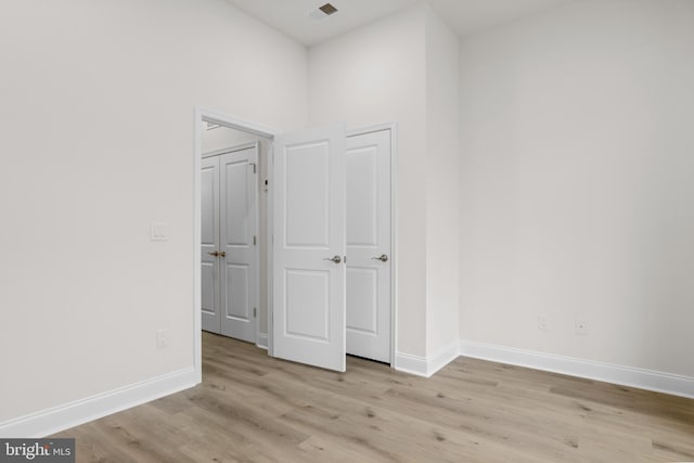 spare room with light hardwood / wood-style floors