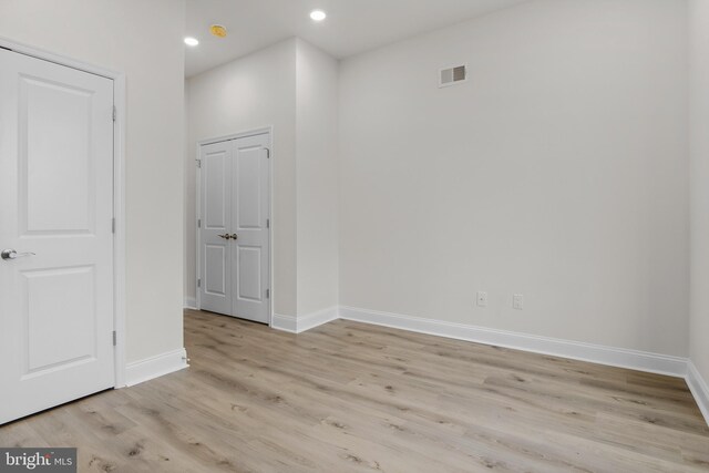 spare room with light wood-type flooring