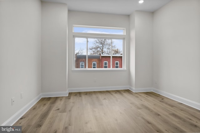 spare room featuring light hardwood / wood-style flooring