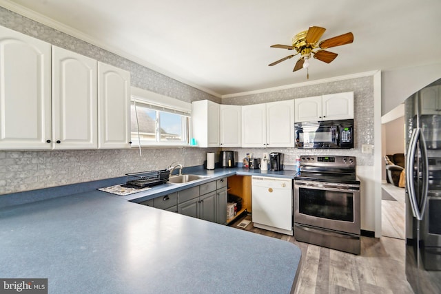 kitchen featuring light hardwood / wood-style flooring, white cabinetry, ceiling fan, and appliances with stainless steel finishes