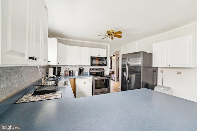 kitchen with white cabinets, stainless steel appliances, crown molding, ceiling fan, and sink