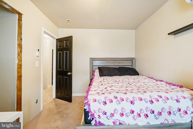 bedroom featuring light colored carpet