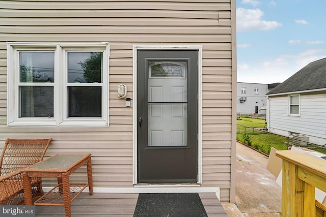 doorway to property with a wooden deck