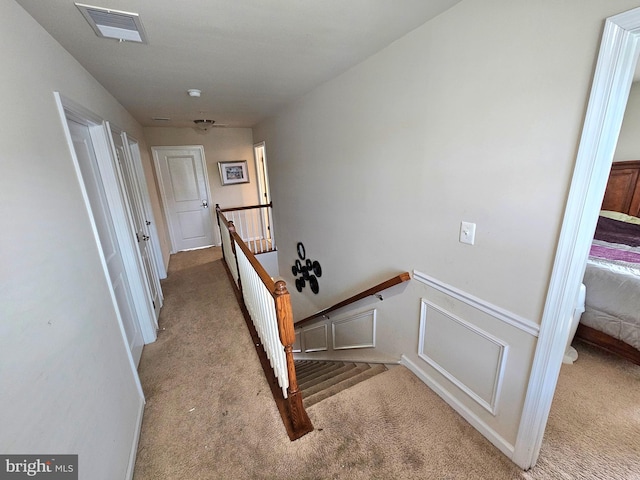 staircase with carpet flooring