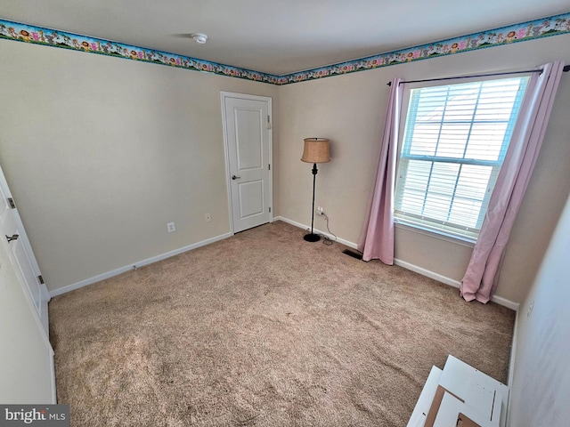 view of carpeted spare room