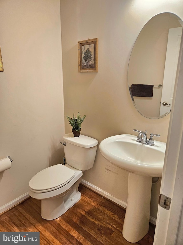 bathroom featuring toilet and hardwood / wood-style flooring