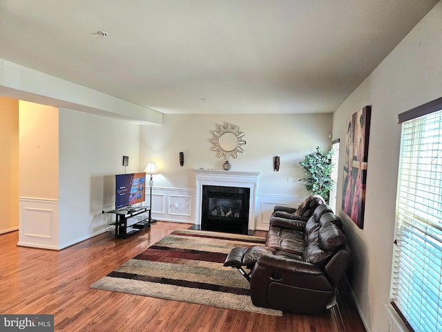 living room with vaulted ceiling and hardwood / wood-style floors