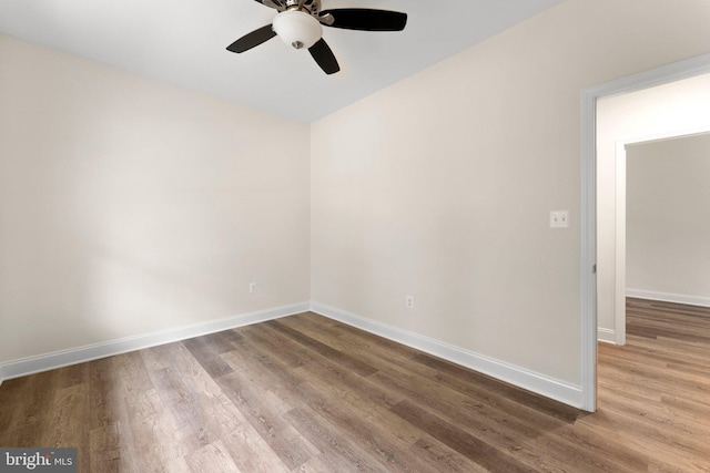 unfurnished room with wood-type flooring and ceiling fan