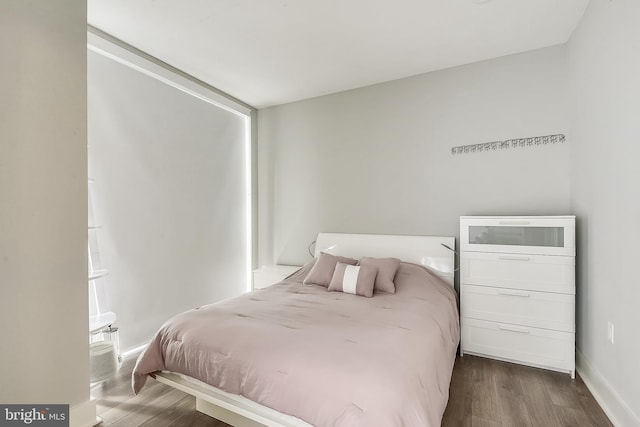 bedroom featuring dark hardwood / wood-style floors