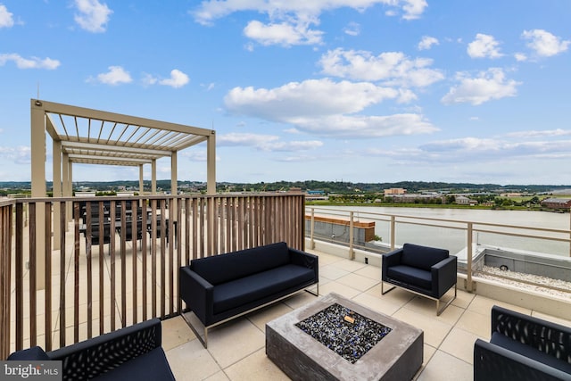 view of patio with an outdoor living space with a fire pit and a pergola