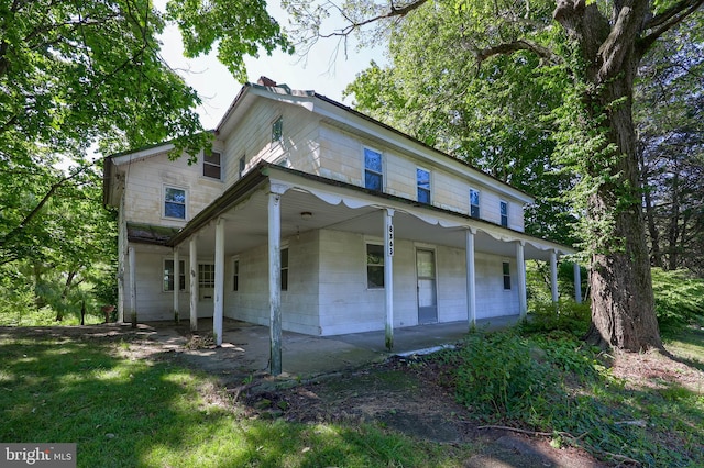 view of home's exterior with a lawn