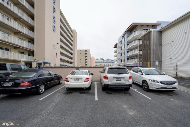 uncovered parking lot with a view of city