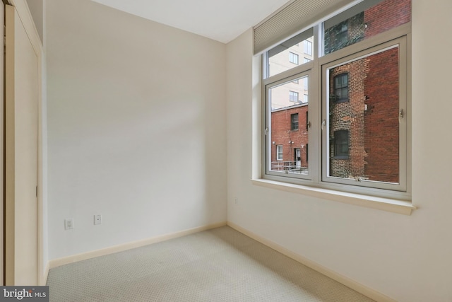 empty room with carpet flooring