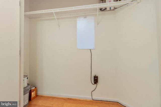 laundry room featuring light hardwood / wood-style flooring