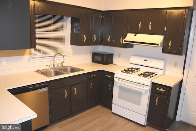 kitchen featuring stainless steel dishwasher, white gas range, dark brown cabinets, sink, and light hardwood / wood-style floors