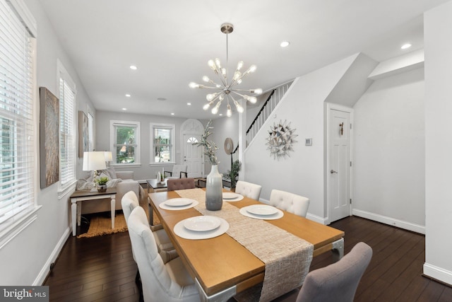 dining area featuring hardwood / wood-style floors, stairs, recessed lighting, and a chandelier