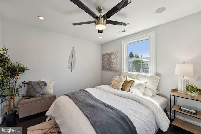 bedroom featuring dark hardwood / wood-style flooring and ceiling fan