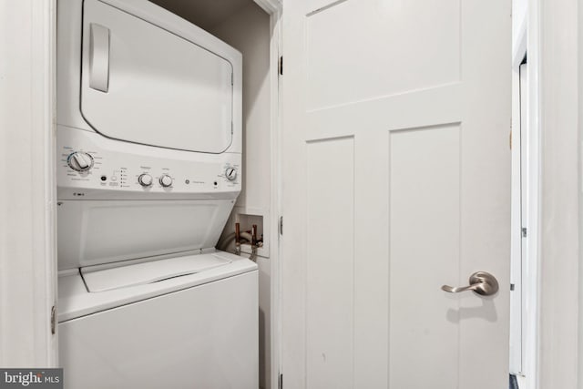 laundry room with stacked washer and clothes dryer