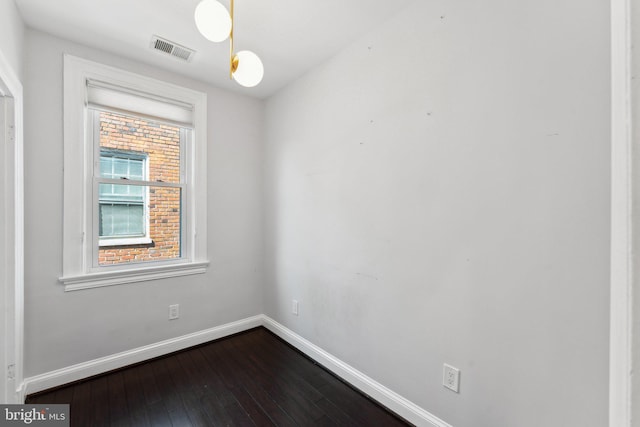 empty room featuring dark hardwood / wood-style floors