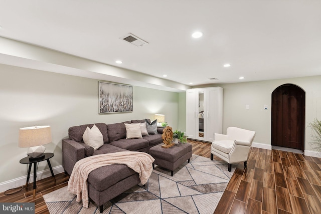 living room featuring dark hardwood / wood-style flooring