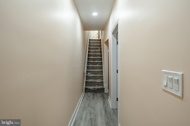 hall with light hardwood / wood-style flooring