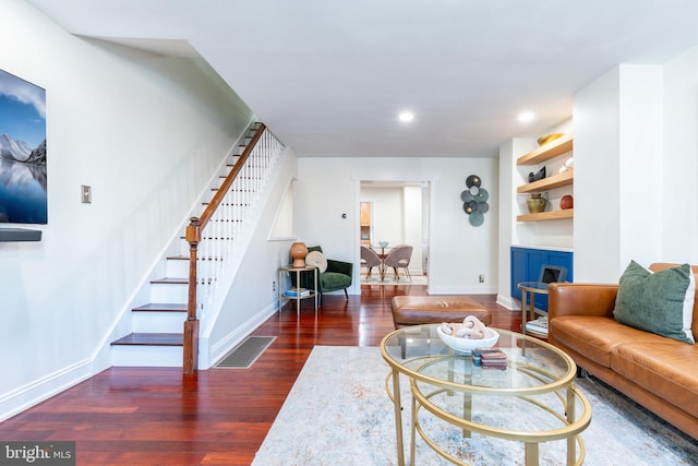 living room featuring dark wood-type flooring