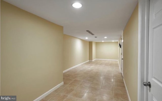 hallway featuring light tile patterned flooring