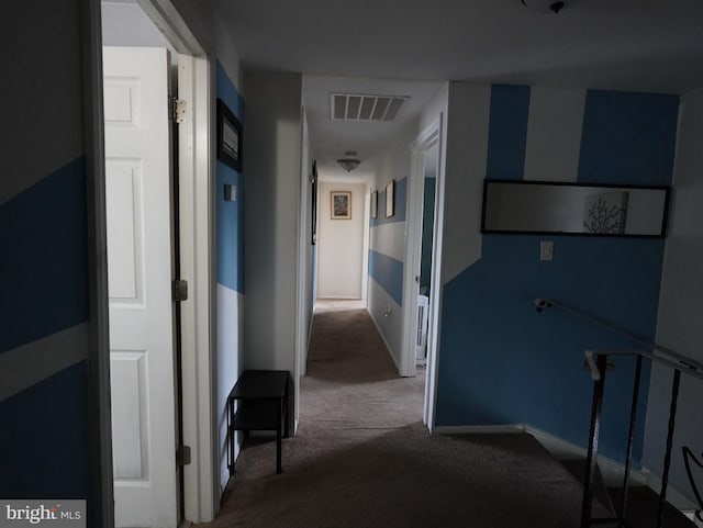 hallway with carpet floors