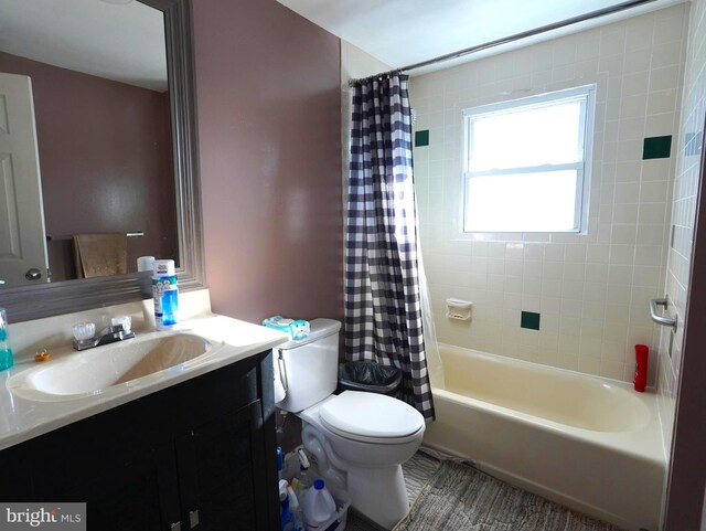 bathroom with toilet, vanity, and shower / bathtub combination with curtain