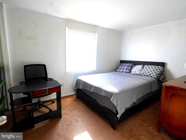 carpeted bedroom with baseboards