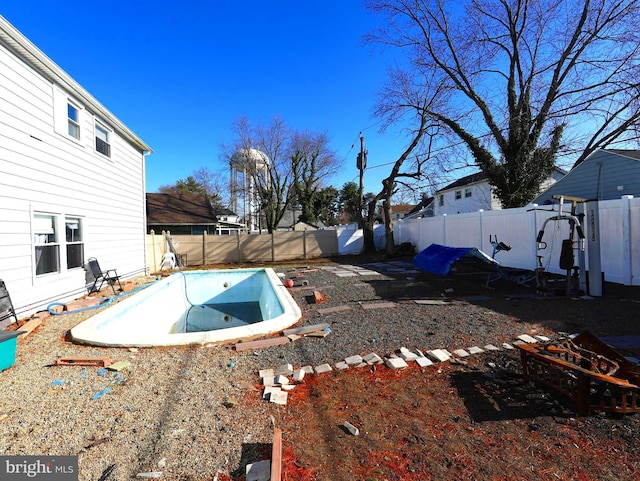 view of yard with a patio area, a fenced in pool, and a fenced backyard