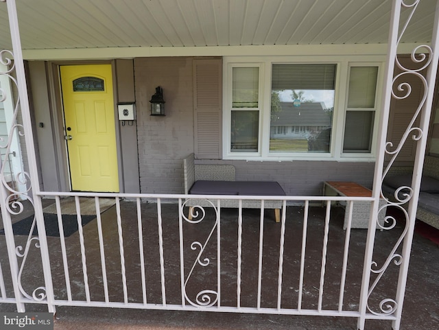 doorway to property with covered porch