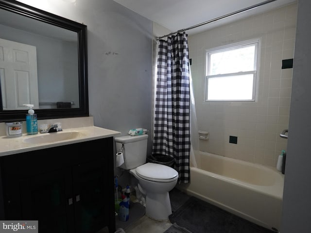 full bathroom featuring shower / bath combo with shower curtain, toilet, and vanity