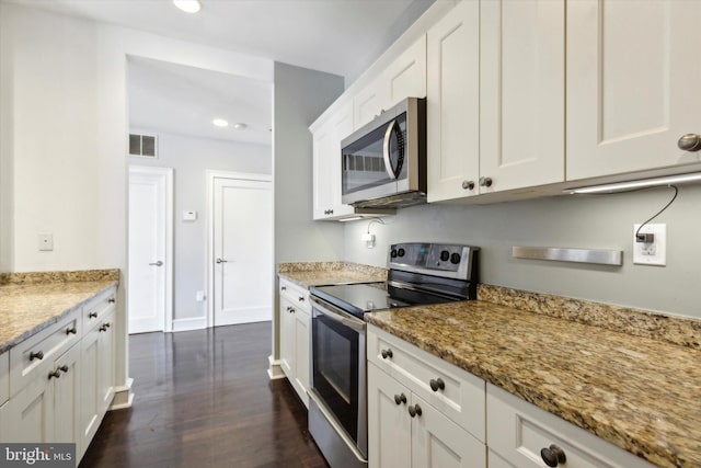 kitchen featuring light stone countertops, stainless steel appliances, dark hardwood / wood-style floors, and white cabinetry