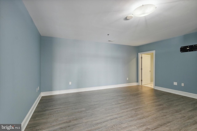 unfurnished room featuring hardwood / wood-style flooring