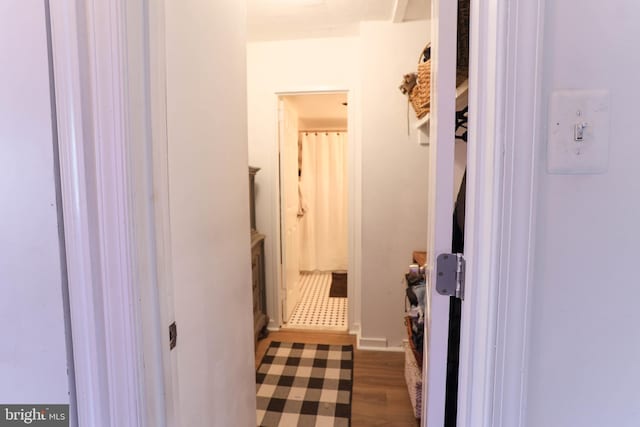 corridor featuring hardwood / wood-style floors