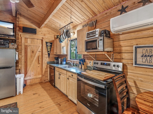 kitchen featuring ceiling fan, lofted ceiling, sink, stainless steel appliances, and light wood-type flooring