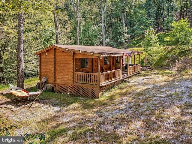 rear view of property with a wooden deck