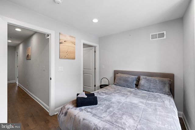 bedroom featuring wood-type flooring