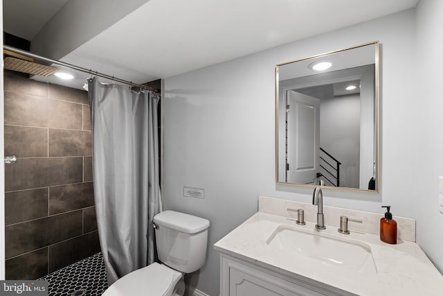 bathroom featuring vanity, toilet, and a shower with curtain