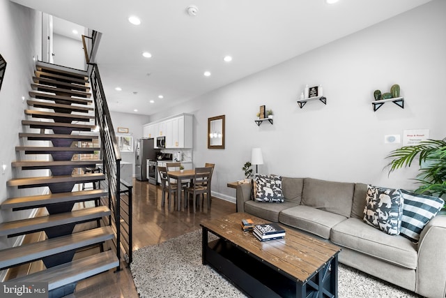 living room with dark hardwood / wood-style floors