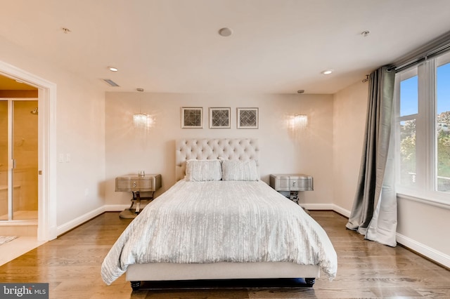 bedroom featuring recessed lighting, visible vents, baseboards, and wood finished floors