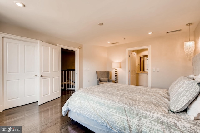 bedroom with recessed lighting, visible vents, and wood finished floors