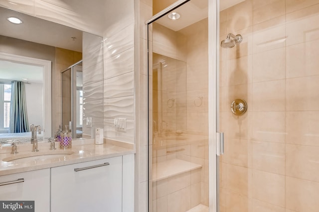 bathroom with vanity and a stall shower