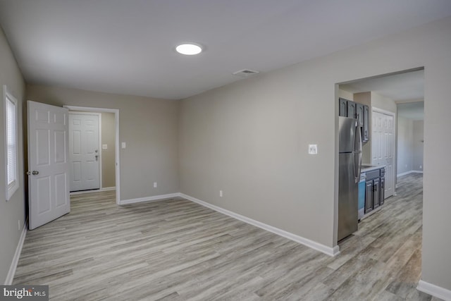 unfurnished room featuring light hardwood / wood-style floors