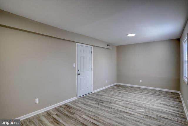 empty room with light hardwood / wood-style floors