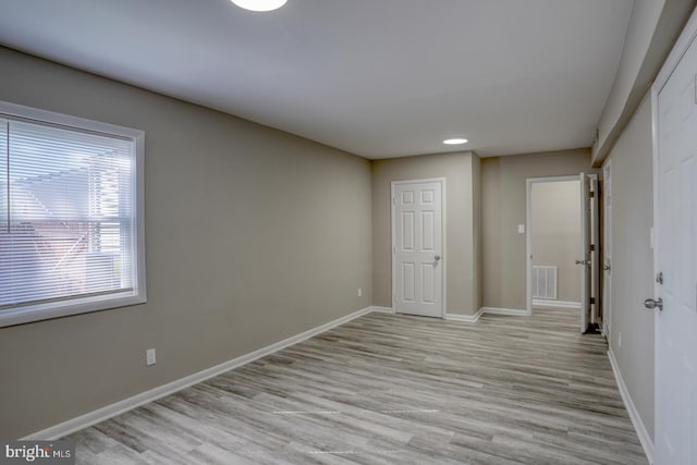 unfurnished bedroom with light hardwood / wood-style flooring